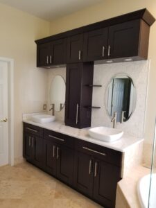 Bathroom with two sinks and many different cabinets